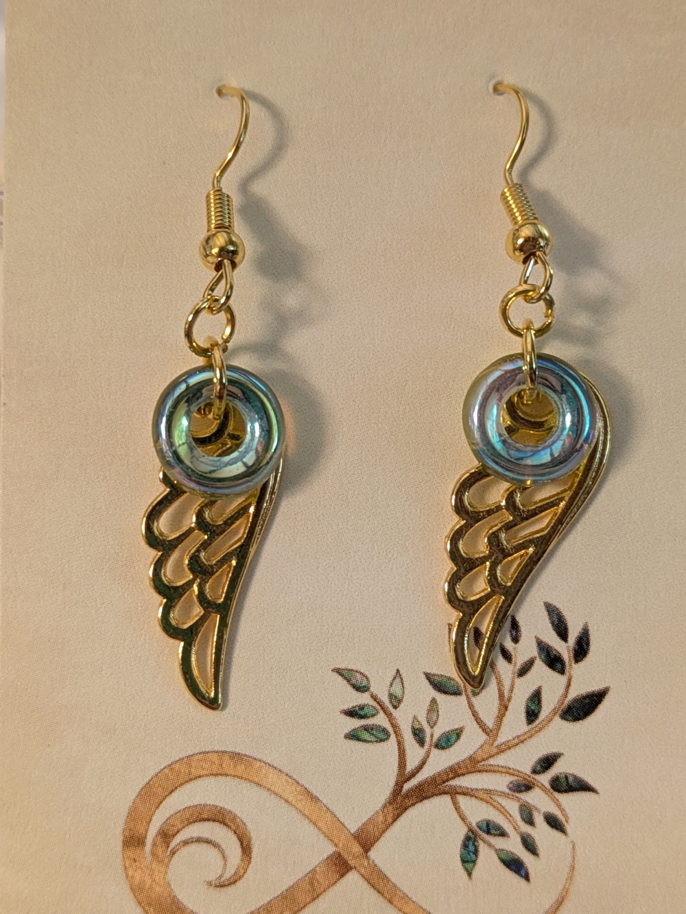 Gold Wing Drop Earrings with Blue Glass Ring Iridescent Accent